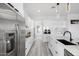 Modern kitchen with white cabinets and stainless steel appliances at 47970 N Navidad Ct, Gold Canyon, AZ 85118