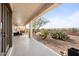 Covered patio with backyard access and desert landscaping at 47970 N Navidad Ct, Gold Canyon, AZ 85118