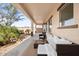 Covered patio with seating area and desert landscaping at 47970 N Navidad Ct, Gold Canyon, AZ 85118
