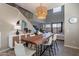 Dining area with a live-edge wood table and modern chandelier at 544 N Alma School Rd # 8, Mesa, AZ 85201