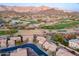 Aerial view of a residential community with golf course and mountain backdrop at 6069 S Sandtrap Dr, Gold Canyon, AZ 85118