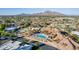 Community pool and surrounding landscape with mountain views at 6147 E Lewis Ave, Scottsdale, AZ 85257