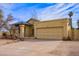 Single story home with attached garage and desert landscaping at 6701 W Monterey Way, Phoenix, AZ 85033