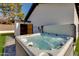 Relax in this inviting hot tub, complete with a wooden enclosure and adjacent sauna at 6718 N 15Th St, Phoenix, AZ 85014