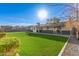 Large backyard with lush grass and a view of the home's back exterior at 6944 E Diamond St, Scottsdale, AZ 85257