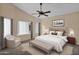 Main bedroom with king-size bed and sitting area, featuring natural light at 9665 E Friess Dr, Scottsdale, AZ 85260