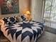 Cozy bedroom featuring a star pattern quilt, adjacent to a balcony with natural light at 9708 E Via Linda -- # 2322, Scottsdale, AZ 85258