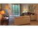 Living room with comfy couch and sliding glass doors leading to balcony at 9708 E Via Linda -- # 2322, Scottsdale, AZ 85258