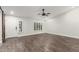 Living room with barn doors, a ceiling fan, and plenty of natural light at 9845 E Natal Ave, Mesa, AZ 85209