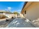 Side yard with a concrete walkway and gate at 10130 W Pine Springs Dr, Sun City, AZ 85373