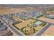 An aerial shot of a community showcasing modern homes, landscaping, and community green spaces at 11029 E Ulysses Ave, Mesa, AZ 85212