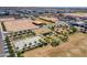 Overhead view of a community park with amenities including a basketball court and playground near homes under construction at 11029 E Ulysses Ave, Mesa, AZ 85212