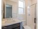 Clean bathroom featuring a walk-in shower, light countertops and a vanity at 11029 E Ulysses Ave, Mesa, AZ 85212