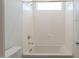 Bathroom featuring a bathtub with shower and a window providing natural light at 11029 E Ulysses Ave, Mesa, AZ 85212