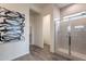 Bathroom featuring a glass-enclosed shower with gray tiles, and neutral walls and floors at 11029 E Ulysses Ave, Mesa, AZ 85212