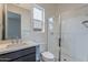 Bathroom featuring a glass shower, modern vanity and neutral color palette at 11029 E Ulysses Ave, Mesa, AZ 85212