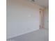 Neutral bedroom with a closet and a door to another room, plus gray carpet at 11029 E Ulysses Ave, Mesa, AZ 85212