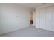 Bright bedroom with neutral walls and carpet with double-door closet offering ample space at 11029 E Ulysses Ave, Mesa, AZ 85212