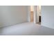 Carpeted bedroom with doorways to closet and bathroom at 11029 E Ulysses Ave, Mesa, AZ 85212