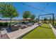 Inviting common area with outdoor seating, decorative landscaping, pergola and string lights perfect for outdoor enjoyment at 11029 E Ulysses Ave, Mesa, AZ 85212