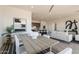 Open concept dining area with modern decor, view of kitchen island, and comfortable seating at 11029 E Ulysses Ave, Mesa, AZ 85212