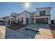 Modern home with a two-car garage, sleek driveway, and minimalist landscaping for curb appeal at 11029 E Ulysses Ave, Mesa, AZ 85212