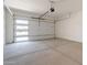 Spacious garage with concrete floor and windowed garage door at 11029 E Ulysses Ave, Mesa, AZ 85212