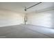 Clean two car garage with white walls and concrete floor at 11029 E Ulysses Ave, Mesa, AZ 85212