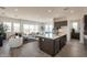 Open kitchen featuring an island with seating, stainless steel appliances, and dark wood cabinetry at 11029 E Ulysses Ave, Mesa, AZ 85212
