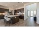 Modern kitchen with a center island, barstool seating, and stainless steel appliances at 11029 E Ulysses Ave, Mesa, AZ 85212