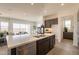 Open kitchen with a large island, stainless steel appliances, and easy access to the living space at 11029 E Ulysses Ave, Mesa, AZ 85212