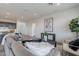 Bright living room with a neutral sectional, modern décor, and open floor plan at 11029 E Ulysses Ave, Mesa, AZ 85212