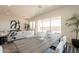 Bright, open-concept living room and dining area with sliding glass doors to the patio at 11029 E Ulysses Ave, Mesa, AZ 85212