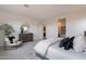 Bright main bedroom featuring modern decor, neutral colors, and recessed lighting at 11029 E Ulysses Ave, Mesa, AZ 85212
