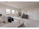 Bright, spacious main bedroom with a gray bed, modern décor, and ample natural light at 11029 E Ulysses Ave, Mesa, AZ 85212
