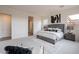 Spacious main bedroom with a gray bed, modern decor, and accent seating at 11029 E Ulysses Ave, Mesa, AZ 85212