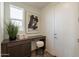 Bright office nook with desk, stool, storage, and natural light at 11029 E Ulysses Ave, Mesa, AZ 85212