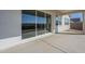 Covered patio features concrete floor and large sliding glass doors at 11029 E Ulysses Ave, Mesa, AZ 85212