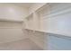 Spacious walk-in closet featuring ample shelving and chrome closet rods for optimal organization and storage at 11029 E Ulysses Ave, Mesa, AZ 85212