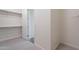View of the walk-in closet with neutral walls and carpet and an opening to the main living space at 11029 E Ulysses Ave, Mesa, AZ 85212