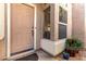 Front entry with light brown door and side window at 1220 N Cliffside Dr, Gilbert, AZ 85234