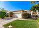 Single story home with attached garage and well-maintained lawn at 1220 N Cliffside Dr, Gilbert, AZ 85234