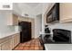 Bright kitchen features wood cabinets, black appliances, and tile flooring at 1220 N Cliffside Dr, Gilbert, AZ 85234