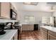 Galley kitchen with light wood cabinets and tile floor at 1220 N Cliffside Dr, Gilbert, AZ 85234