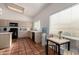 Kitchen features light wood cabinets, island and tile floors at 1220 N Cliffside Dr, Gilbert, AZ 85234