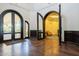 Elegant lobby with arched doorways and hardwood floors at 1220 N Cliffside Dr, Gilbert, AZ 85234