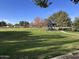 Community park with grassy areas, playground, and shade structures at 1220 N Cliffside Dr, Gilbert, AZ 85234