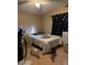 Bright bedroom with a double bed and wood floors at 12629 S Tuthill Rd, Buckeye, AZ 85326
