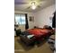 Bedroom with double bed, dresser, and window at 12629 S Tuthill Rd, Buckeye, AZ 85326