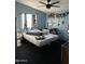 Bedroom with double bed and floral decor at 12629 S Tuthill Rd, Buckeye, AZ 85326